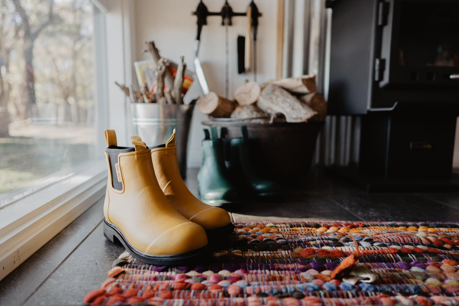 Yellow Bobbi Boots near a sunny window