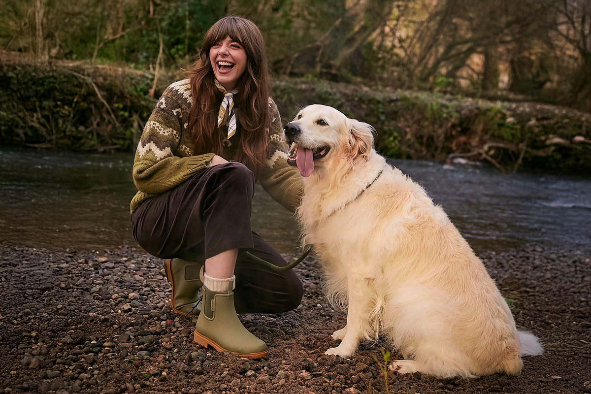 Dog walker wearing Merry People Bobbi Boots on a wet morning walk